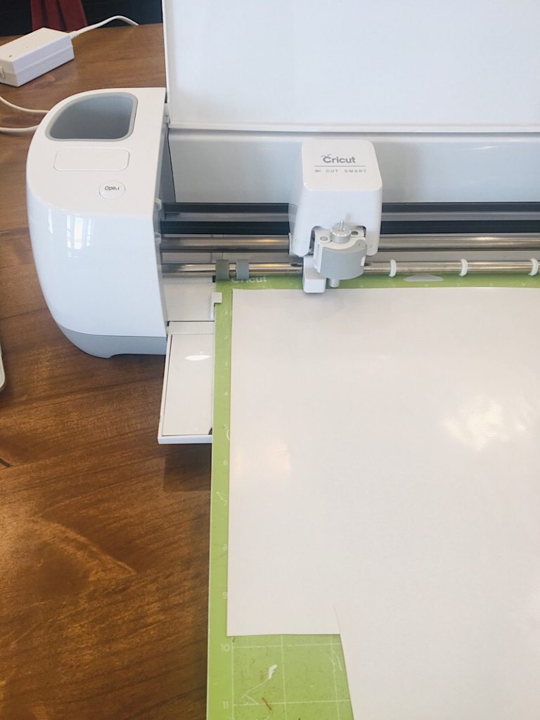 Cricut machine loaded with vinyl