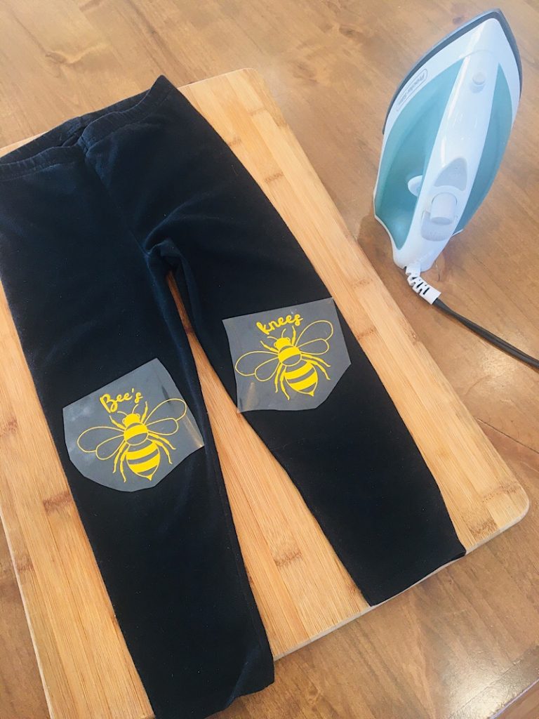 place iron on vinyl onto pants