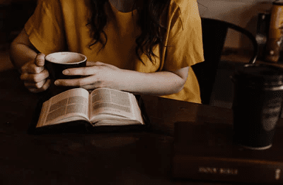 Woman Reading Book with drink