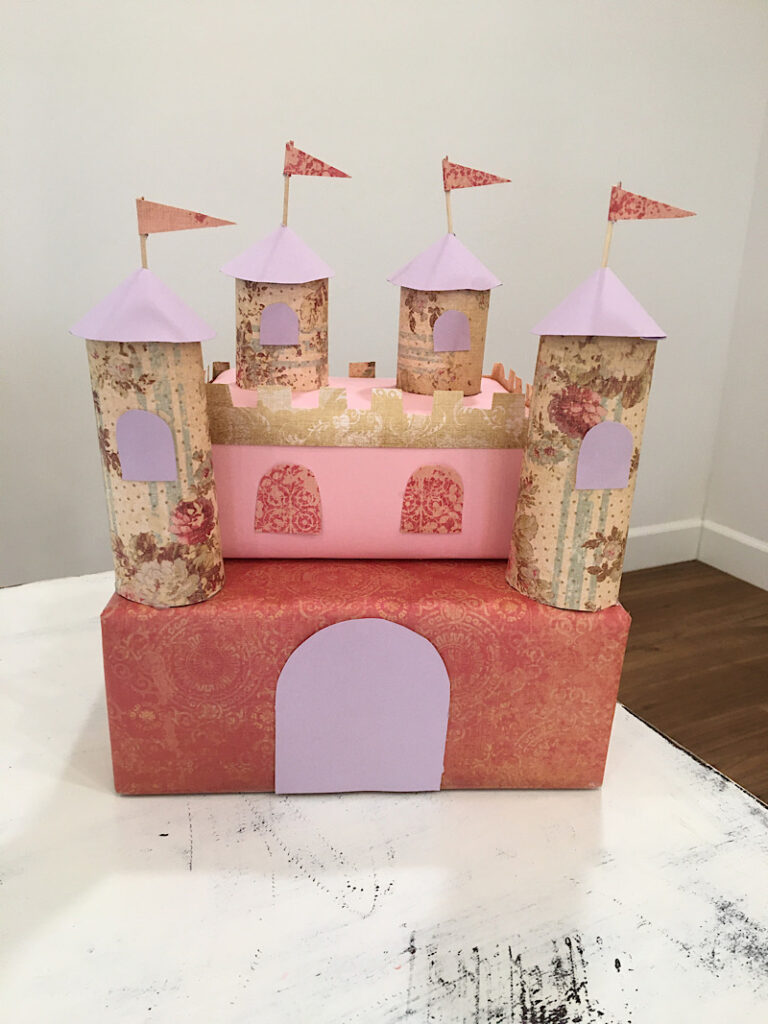 Valentines Day Card Box that looks like a pink princess castle with towers and flags a draw bridge and windows