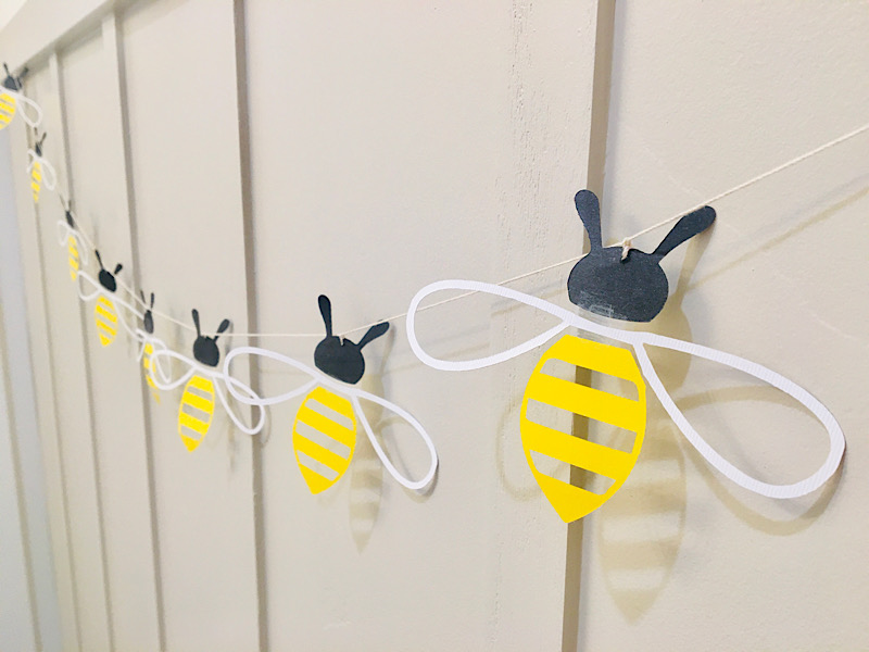 honey bee garland on wall